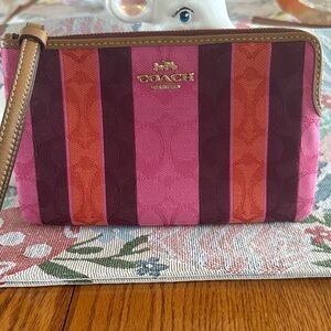 COACH Pink, Burgundy & Orange Striped Wristlet with Tan Trim